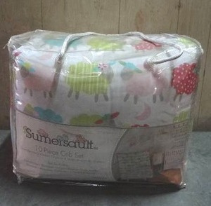 lot 97 image: Sumersault Lamby Pie 10-piece crib bedding set.  Never opened.