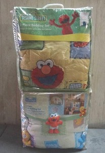 lot 99 image: Sesame Street 3-piece & 4-piece crib bedding sets.  Quantity of 2.  Never opened.