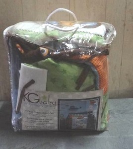 lot 103 image: KG Baby by Kimberly Grant 4-piece crib bedding set.  Racecar themed.  Never opened.