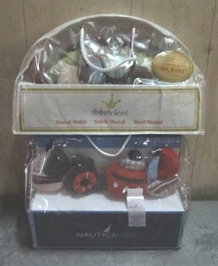 lot 106 image: Kimberly Grant Spa Baby and Nautica ocean themed musical mobiles. 2 count Never opened.