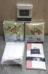 lot 109 image: NoJo baby bedding and nursery accessories. Includes liner, bumper, diaper stackers and wall hangings. Never opened