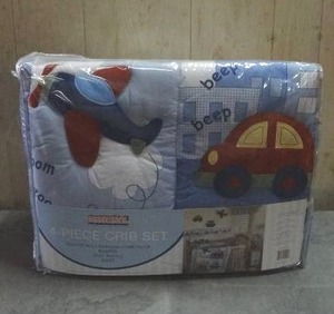 lot 112 image: Bedtime Originals Travel Time 4-piece crib bedding set.  Never opened.