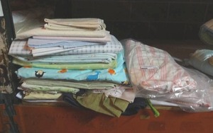 lot 117 image: Assorted baby bedding textiles.  Generous quantity.