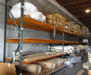 lot 132 image: Industrial shelving racks.  4 sections.  Includes 5 upright frames and 16 shelves.  Each section measures 12 x 12 x 42