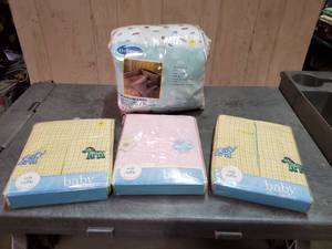 lot 46 image: Baby bedding and accessories. Includes 5-pc bedding set and 3 crib ruffles. Never opened.