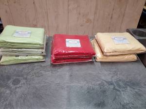 lot 54 image: Koala Baby 100% cotton knit crib sheets.  Quantity of 7.  Never opened.