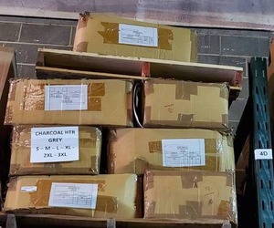 lot 183 image: Pallet of Charcoal Heather Grey 8515 cotton t-shirts. Various sizes. 12 cases. Bid is times the quantity