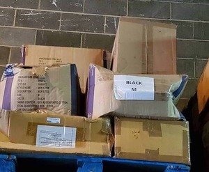 lot 184 image: Pallet of black 100% cotton t-shirts. Size Medium. 14 cases. Bid is times the quantity