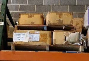 lot 187 image: Pallet of Athletic Heather Grey 8515 cotton t-shirts.  Size Medium. 8 cases. Bid is times the quantity