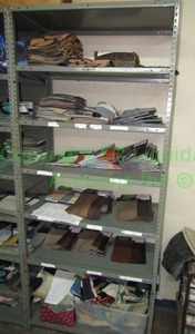 lot 561 image: Assorted fabric samples and remnants contents of shelving unit. Shelving unit not included