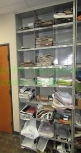 lot 448 image: Assorted fabric samples and remnants contents of shelving unit. Shelving unit not included