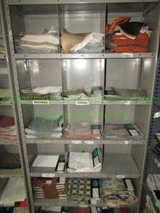 lot 442 image: Assorted fabric samples and remnants contents of shelving unit. Shelving unit not included