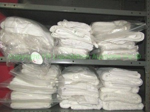 lot 474 image: 100% regenerated cotton towels & wash clothes, Like new Never used, contents of 2 shelves