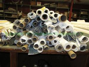 lot 550 image: Large selection of fabric rolls. Generous quantity. Patterns vary. Rack not included.