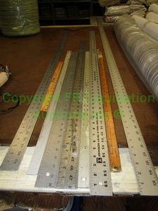 lot 552 image: Assorted fabric rulers varying lengths