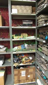 lot 499 image: Assorted fabric samples and remnants contents of shelving unit. Shelving unit not included