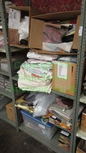 lot 509 image: Assorted fabric samples and remnants contents of shelving unit. Shelving unit not included