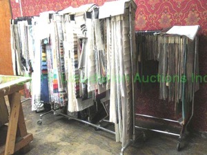 lot 516 image: Clothing racks loaded with fabric samples, 3 racks total