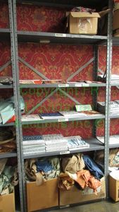 lot 522 image: Assorted fabric samples and remnants contents of shelving unit. Shelving unit not included