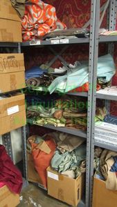 lot 524 image: Assorted fabric samples and remnants contents of shelving unit. Shelving unit not included