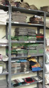 lot 536 image: Assorted fabric samples and remnants contents of shelving unit. Shelving unit not included