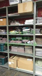 lot 513 image: Assorted fabric samples and remnants contents of shelving unit. Shelving unit not included