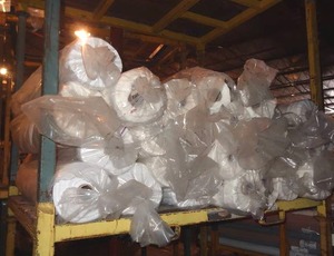 lot 282 image: Large selection of white fabric rolls.  Generous quantity.  Patterns vary.