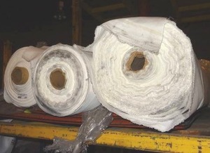 lot 289 image: Large rolls of white fabric.  Patterns vary.