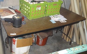 lot 293 image: Folding table w contents.  Includes fabric samples.