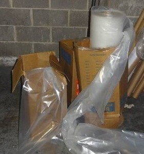 lot 296 image: 3 large rolls of poly tubing.  Currently used to bag rolls of fabric.