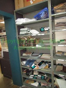 lot 559 image: Assorted fabric samples and remnants contents of shelving unit. Shelving unit not included
