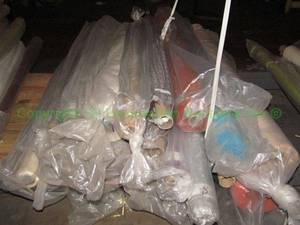 lot 573 image: Large selection of fabric rolls. Generous quantity. Patterns vary.