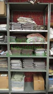 lot 511 image: Assorted fabric samples and remnants contents of shelving unit. Shelving unit not included