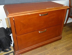 lot 702 image: Wooden 2-drawer lateral file cabinet.  Measures 42 x 31 x 21. Matches lot 700