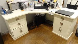 lot 706 image: Wooden L shaped office desk.  Matches lots 707 & 708.  Contents not included.