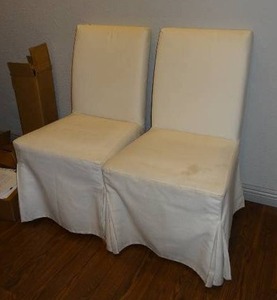 lot 709 image: Lot of 2 chairs w white cloth covers.
