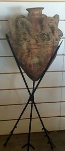 lot 2 image: 4 ft tall Tribal Urn On Iron Arrow Stand
