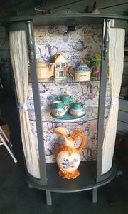 lot 21 image: 5 tall Lighted Teapot Theme Display made from a Vintage Curio Cabinet(contents not included)