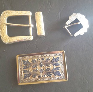 lot 23 image: 4 Pc Belt Buckle Set, Rectangle one is nickel plated