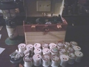 lot 53 image: Fishing Supplies(various test line, lantern, reels, box)