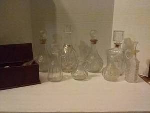 lot 228 image: Vintage Glass Decanters (8) plus Wood Box of Miscellaneous Stoppers