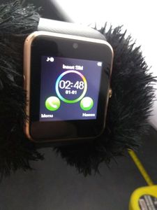 lot 34 image: SMART PHONE WATCH INSTRUCTIONS AND BOX INCLUDED
