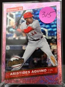 lot 315 image: ROOKIE - ARISTIDES AQUINO (REDS) - 2020 DONRUSS HIGHLIGHTS - PINK FIREWORKS INSERT RC