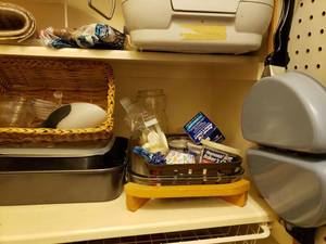 lot 62 image: Contents of Pegboard and Shelf Omelet Pan, Skillets, Cake Pans and Casserole Dish