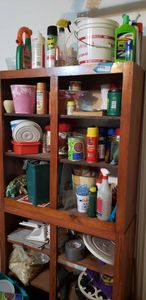 lot 200 image: Contents of Garage Cabinet Bug Killer, Car Polish, Paint Cans, Great Stuff, Planters, Bath Tile, Tarps and More
