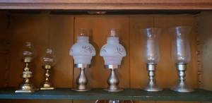 lot 130 image: Pewter Weighted Candle Hurricane Lamps, Set of 3 Brass Candle votives and pair of Metal Base Etched Glass Votives