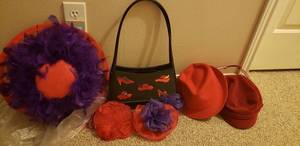 lot 146 image: Red Hat Society Collection purse and hats SM Fedora, Barret, wide-brimmed hat with feathers