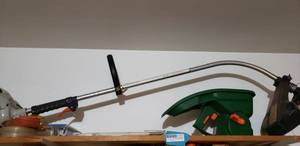 lot 210 image: Hand Spreader, Weed Eater and Extra String