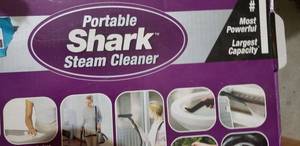 lot 219 image: Portable Shark Steam Cleaner