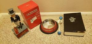 lot 251 image: Vintage Uncle Sam Metal Coin Bank, Chin moves and hand drops coin in bag, Fun in the Fridge Snowman, The Itty-bitty book light, dog dish and wall hanger